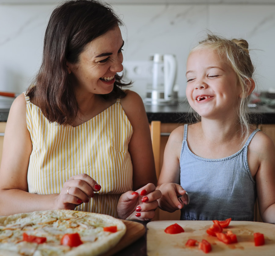 Mother and daughter cooking a healthy dinner