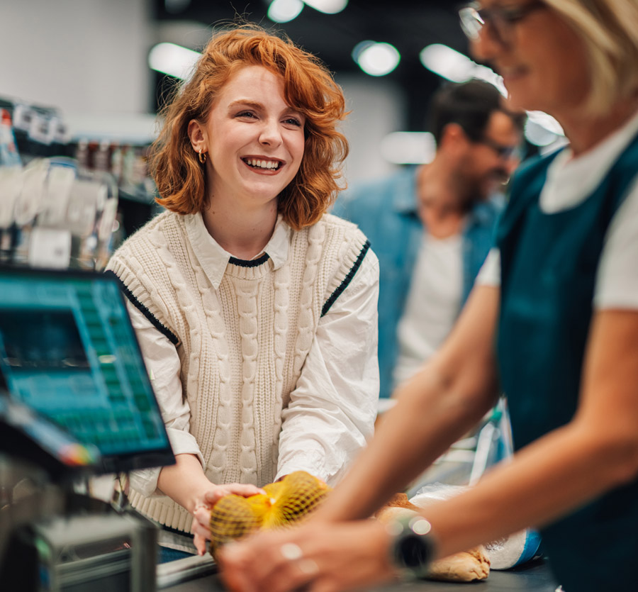 Woman checking out at grocery store